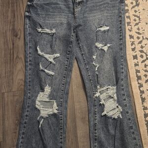 Fashion Nova Ripped Flare Jeans in Blue